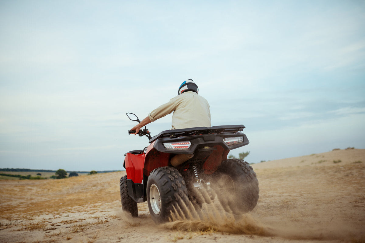 Why do ATVs have thumb throttles vs twist throttles?