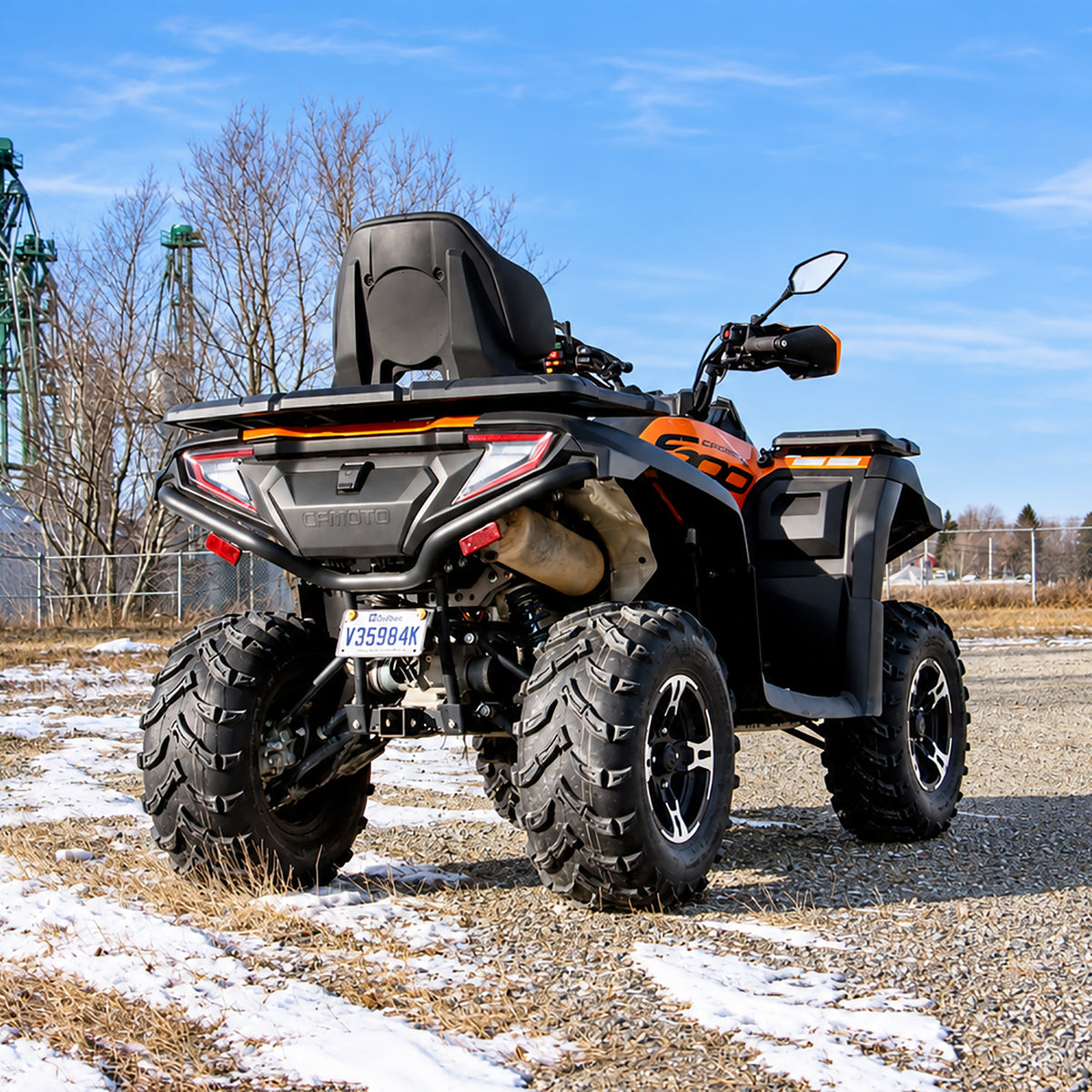 Rear three-quarter view of a CFMOTO CForce 600 Touring with PERFEX 1.5" lift kit installed.