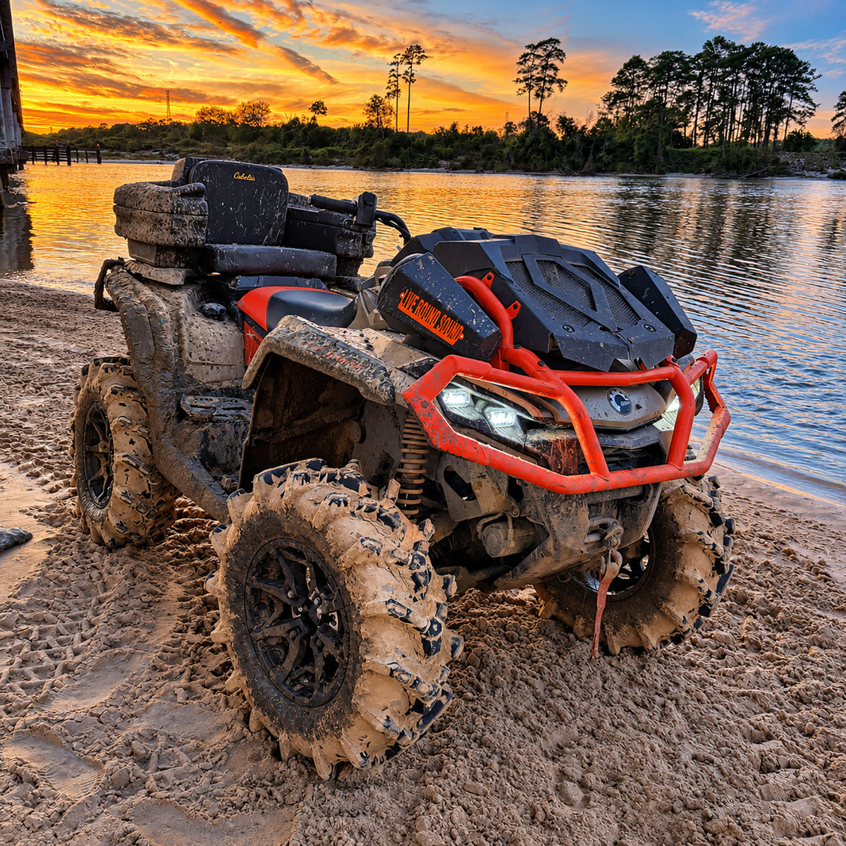Can-Am Outlander X MR 1000R with PERFEX 2-inch lift kit, mud tires and increased ground clearance at an off-road riding area.