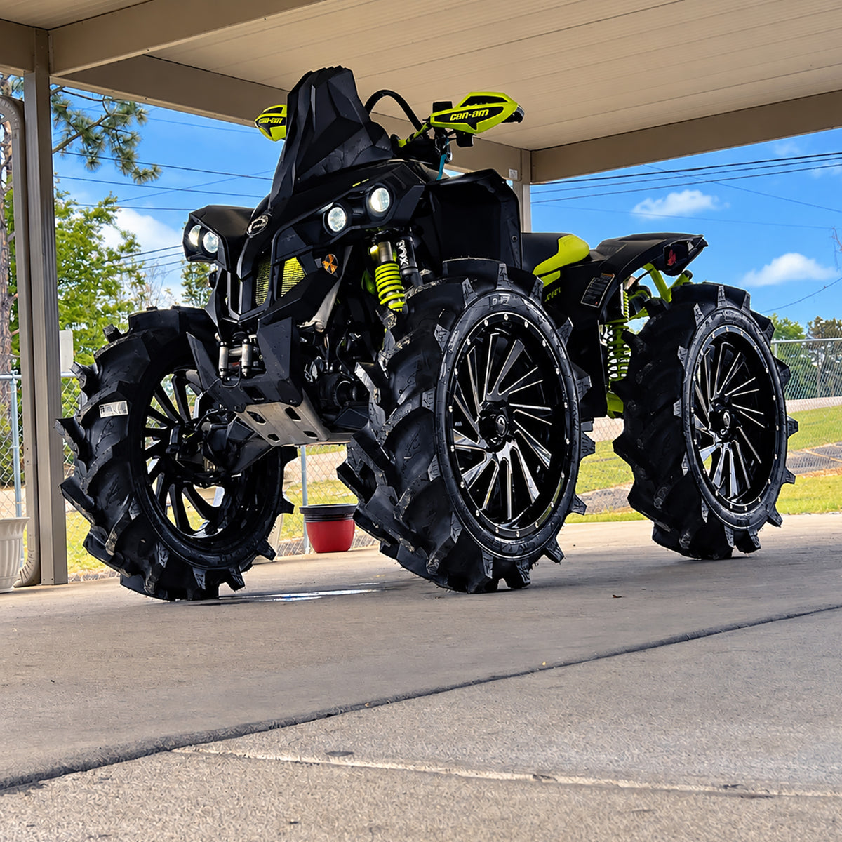 Front angle view of a Can-Am Renegade 1000R with PERFEX 2-inch lift kit, oversized mud tires and increased ground clearance.