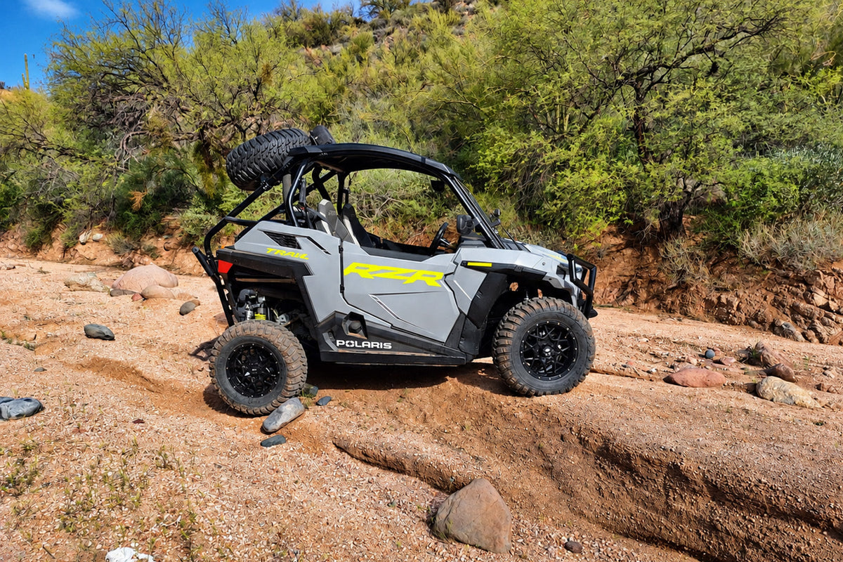 Side view of Polaris RZR Trail UTV with PERFEX 2-inch lift kit and larger off-road tires.