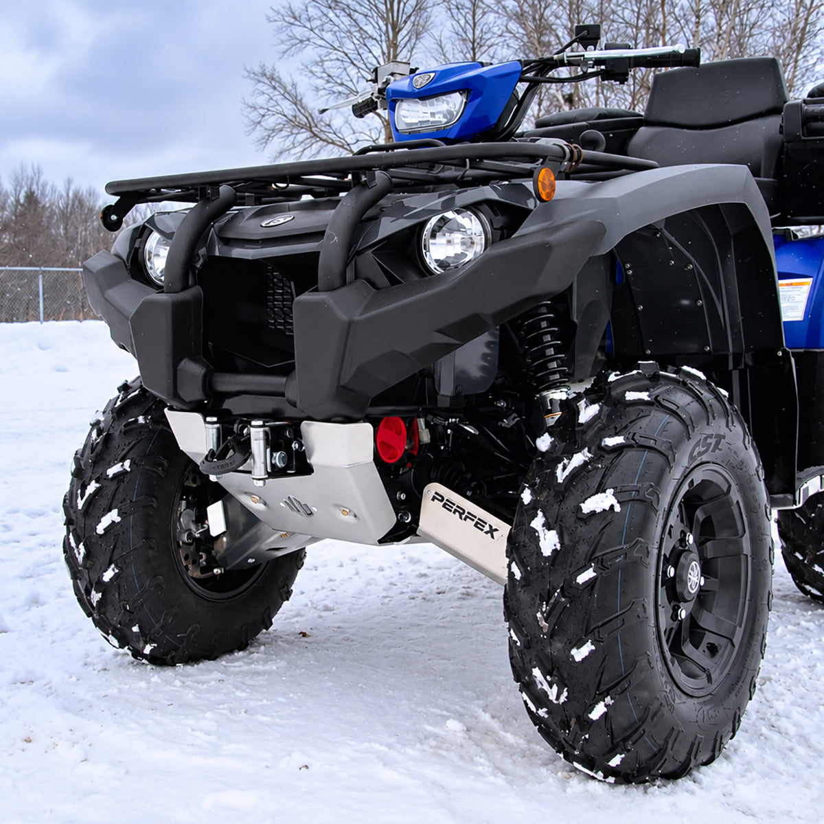 Front three-quarter view of a Yamaha Kodiak 450 ATV equipped with a PERFEX 2-inch lift kit, showing its lifted stance and front ground clearance.