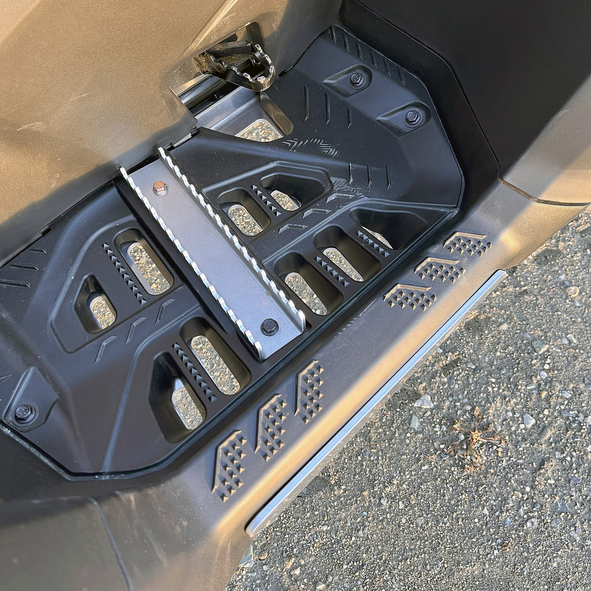 Close-up of PERFEX right aluminum foot peg mounted on a Can-Am Outlander MAX G3 1000R DPS ATV, showcasing robust 1/8-inch aluminum construction.