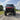 Front angle shot of lifted red CFMoto UForce U10 XL Pro Highland with 2.5-inch PERFEX lift kit and System3 RC500 tires — off-road ready with PERFEX mounting brackets installed
