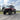 Side view of red UForce U10 XL Pro Highland featuring PERFEX UTV lift kit and 32x10R15 System3 RC500 tires — built for rugged terrain