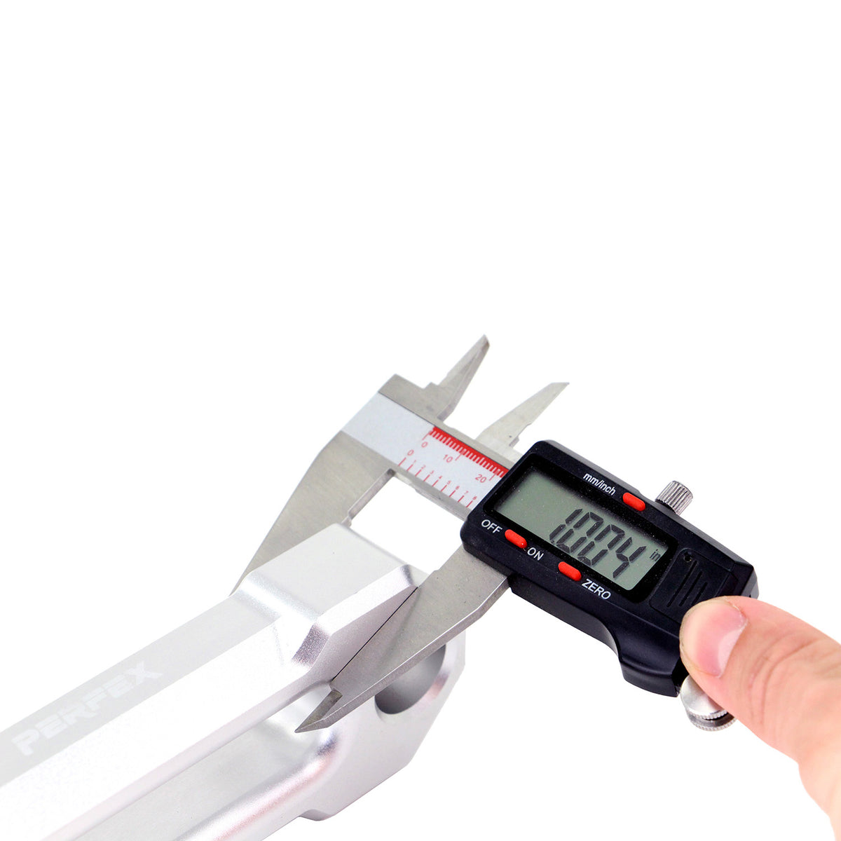 Digital caliper confirming the 1-inch thickness of the PERFEX CNC-machined aluminum ATV hawse fairlead, built with 4-7/8" mounting hole spacing.
