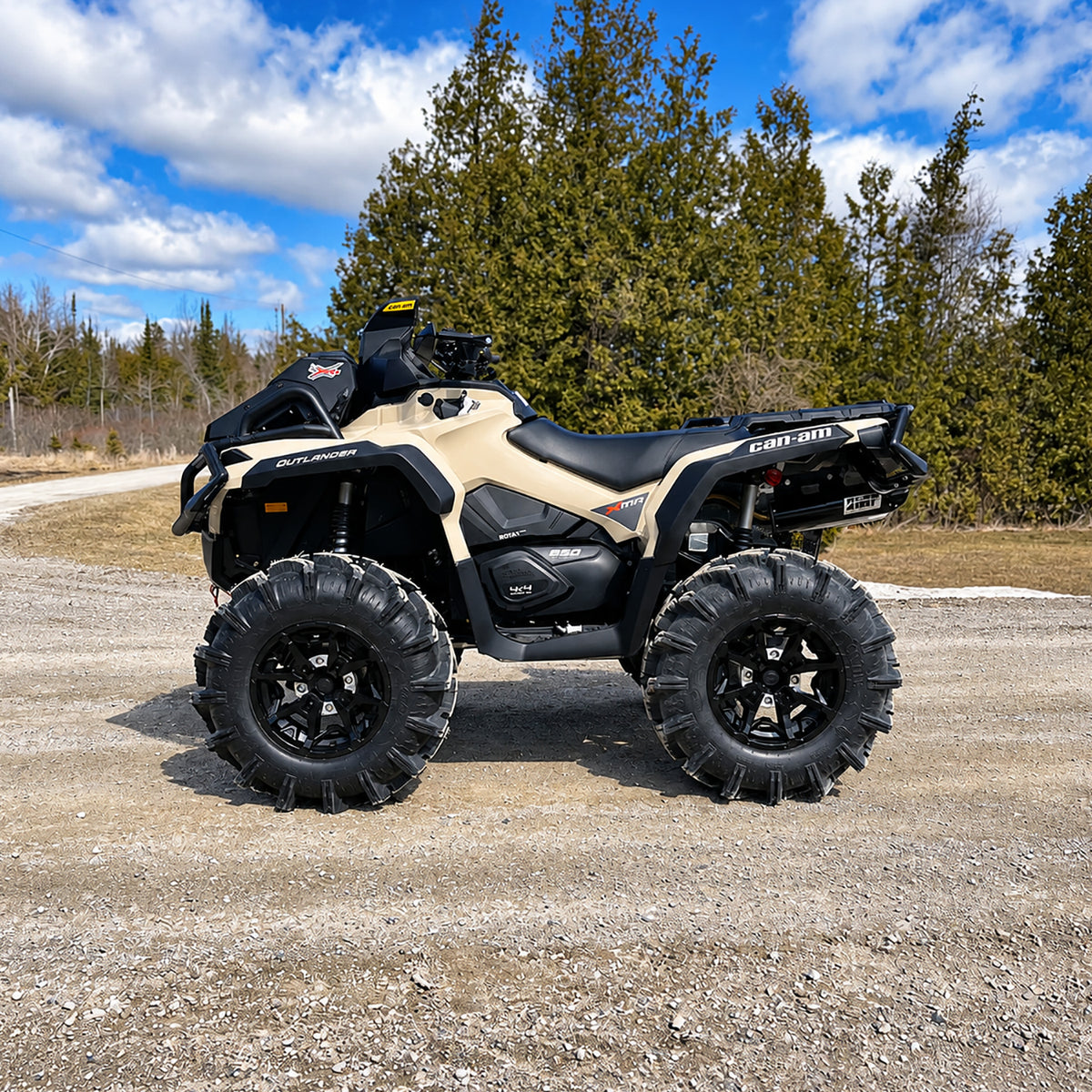 Side view of a Can-Am Outlander X MR 850 showing the raised stance and ground clearance with a PERFEX 2-inch lift kit.