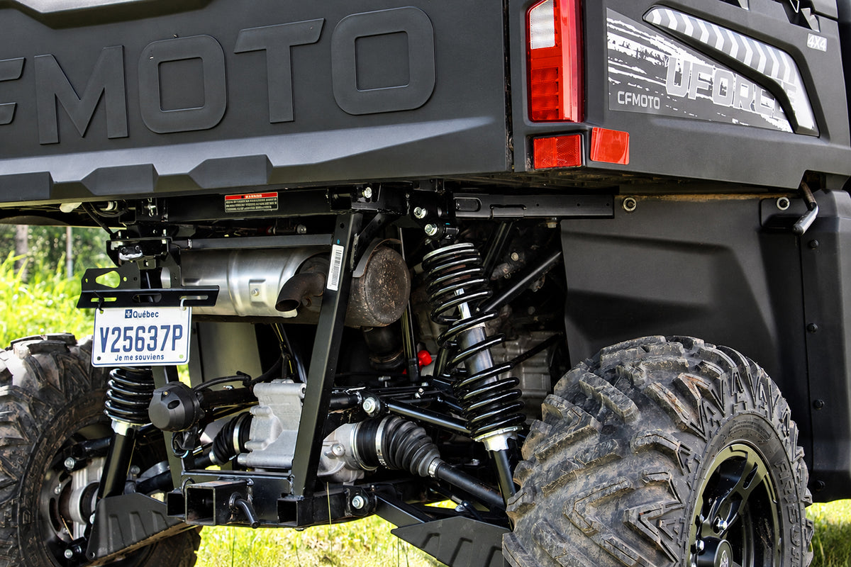 Rear suspension of a CFMOTO UForce 600 with the PERFEX 2-inch lift kit installed.
