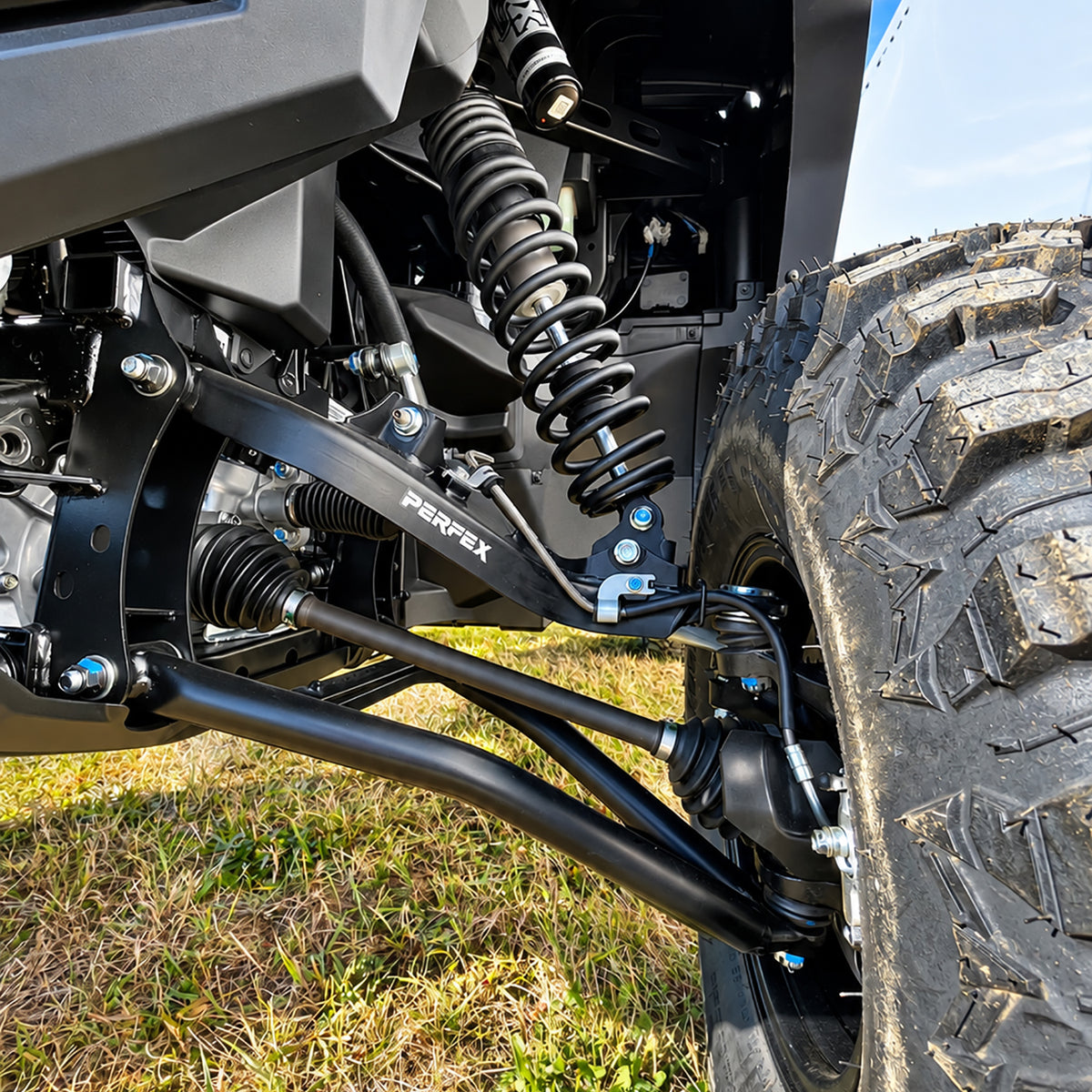 Front suspension installation detail of the PERFEX 2-inch lift kit on Yamaha Wolverine RMAX2 1000.