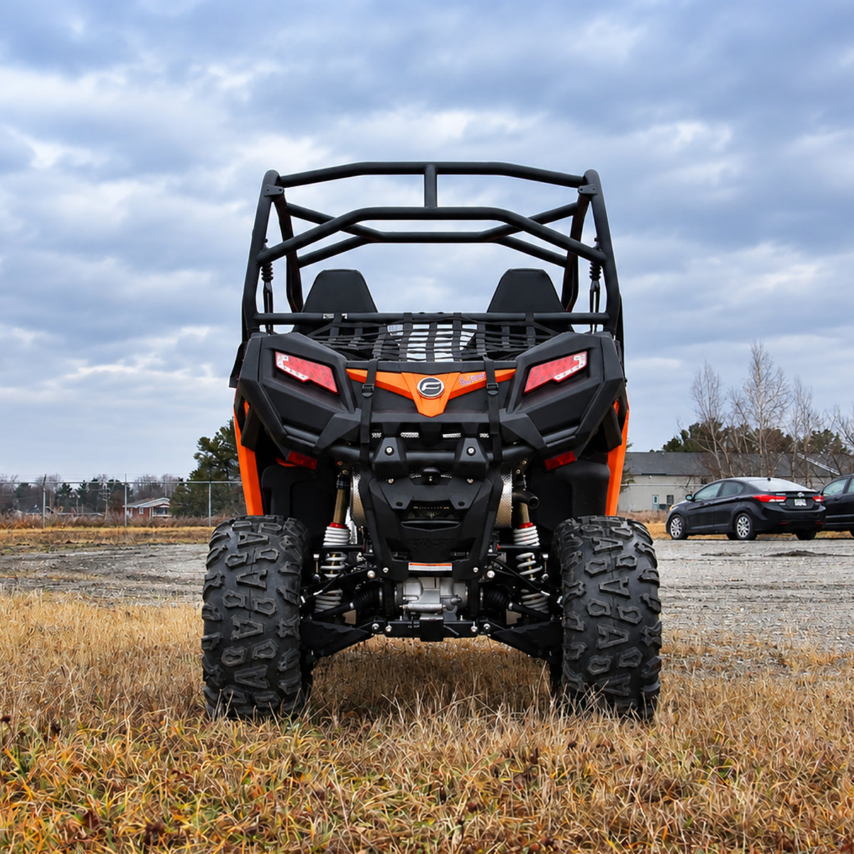 Rear view of a lifted CFMOTO ZForce 500 Trail highlighting its suspension and ground clearance.