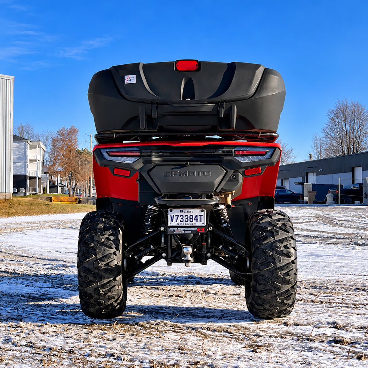 Rear view of a CFMOTO CForce 400 showing the ATV stance and ground clearance with the PERFEX 1.5-inch lift kit.