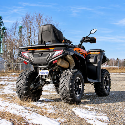Rear three-quarter view of a CFMOTO CForce 600 Touring with PERFEX 1.5" lift kit installed.
