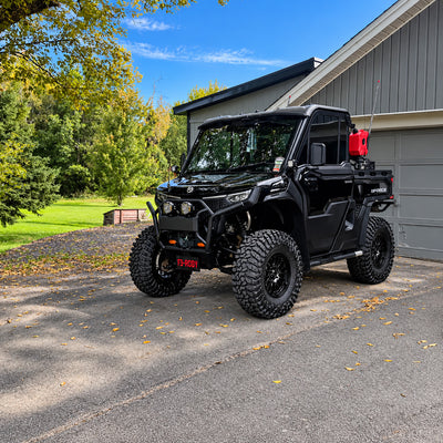 Black 2026 CFMOTO UForce U10 PRO Highland featuring the PERFEX 2.5" lift kit and 32-inch off-road tires, photographed from a front three-quarter angle.
