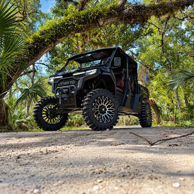 Side view of U10 lifted black on black CFMOTO UForce U10 XL PRO featuring PERFEX 2.5in lift kit, 33-inch System3 XT400 tires and 20-inch MSA wheels.