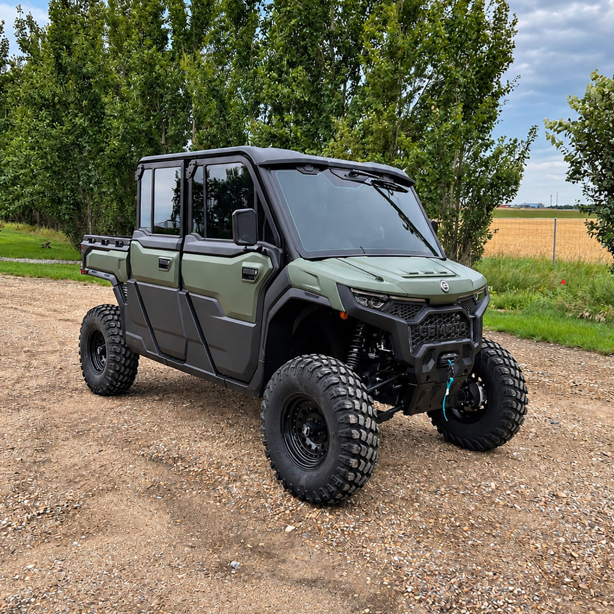 Front three-quarter view of a green CFMOTO UForce U10 XL PRO Highland equipped with the PERFEX 2.5-inch lift kit, showcasing its increased ground clearance and rugged off-road stance.