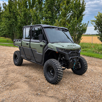 Front three-quarter view of a green CFMOTO UForce U10 XL PRO Highland equipped with the PERFEX 2.5-inch lift kit, showcasing its increased ground clearance and rugged off-road stance.