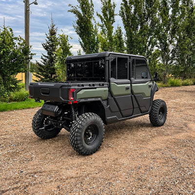 Rear three-quarter view of the CFMOTO UForce U10 XL PRO Highland featuring the Canadian-made PERFEX 2.5-inch suspension lift kit, highlighting its raised chassis and rear suspension clearance.