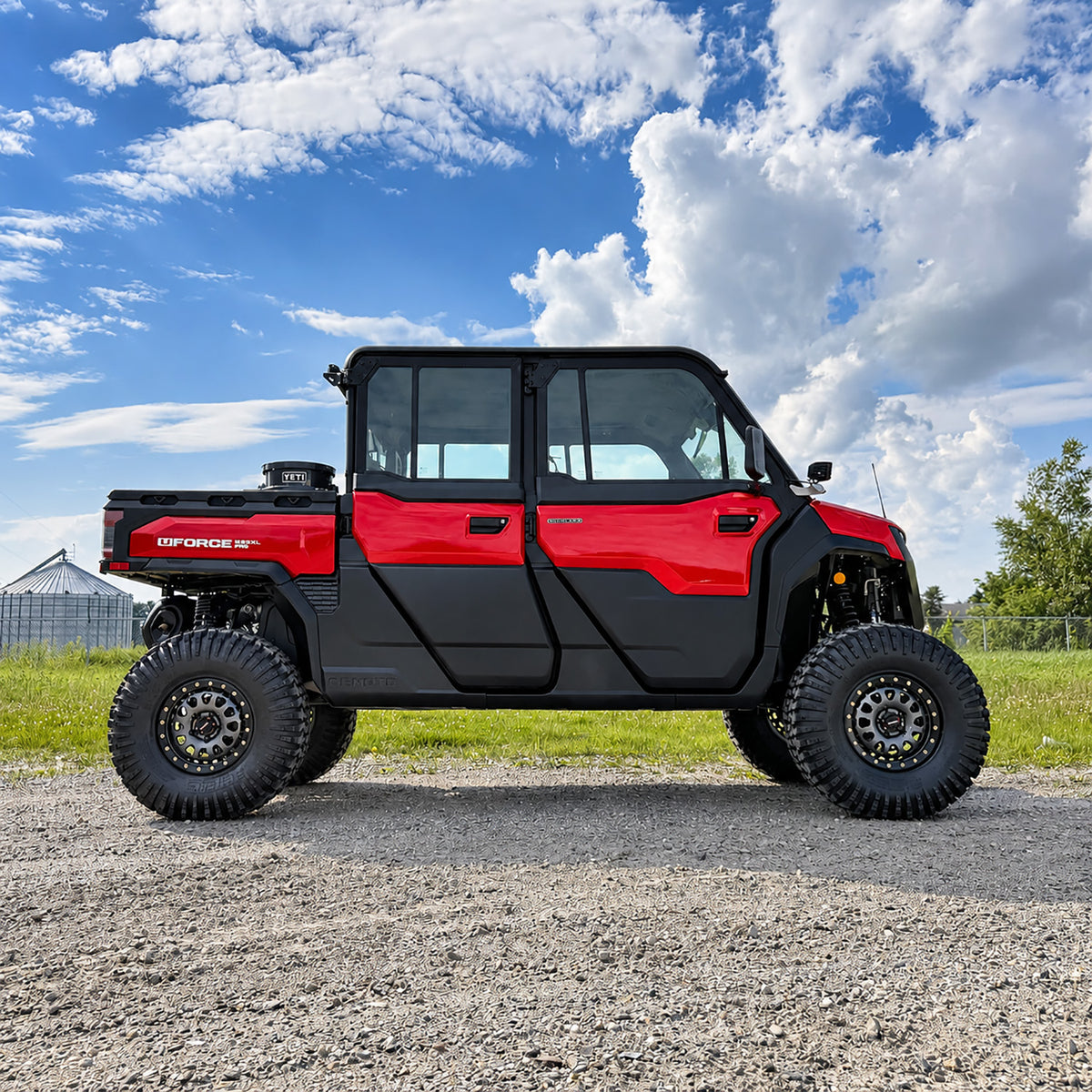 CFMOTO UForce U10 XL Pro Highland in red with PERFEX 2.5in UTV lift kit and 32-inch System3 RC500 tires — aggressive off-road stance with visible cube lights.