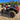 Mud-covered Can-Am Outlander X MR 1000R equipped with a PERFEX 2-inch lift kit and aggressive mud tires.
