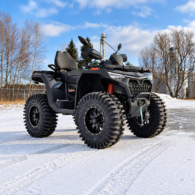 Front angle view of a lifted CFMOTO CForce 1000 Touring on 30-inch System 3 XT400 tires, showing its increased stance and ground clearance.