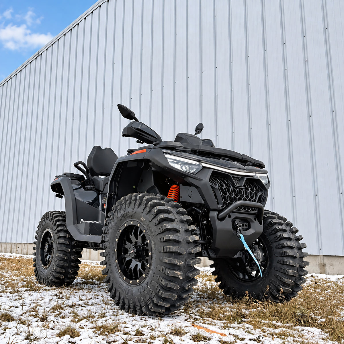 Low front angle view of a CFMOTO CForce 1000 Touring with PERFEX 2-inch lift kit and 30-inch System 3 XT400 tires.