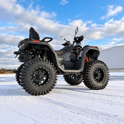 Rear side view of a lifted CFMOTO CForce 1000 Touring showing the 30-inch tires, suspension and increased ground clearance.