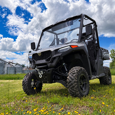 Low-angle view of a CFMOTO UForce 600 with the PERFEX 2-inch lift kit installed.