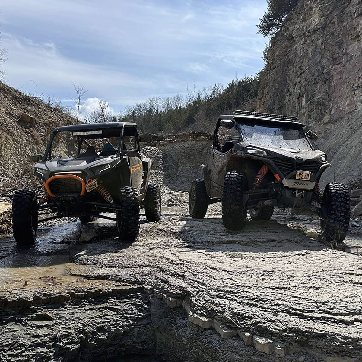 CFMOTO ZForce 950 Sport G2 with PERFEX Lift Kit alongside Polaris RZR XP 1000 on off-road trail.