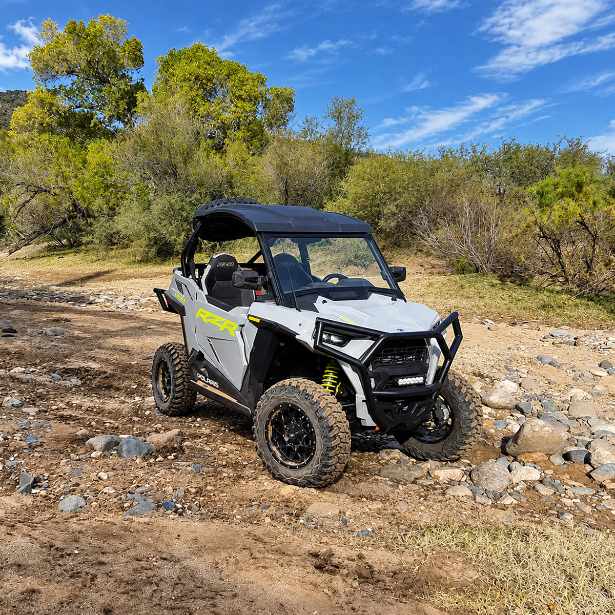 Polaris RZR Trail 900 Ultimate with PERFEX 2-inch lift kit on rocky off-road terrain.