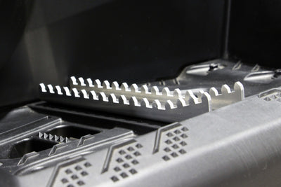 Close-up view of the 20° angled sides on the PERFEX left aluminum ATV foot peg, installed on a Can-Am Outlander G3 1000R XT-P for superior traction.