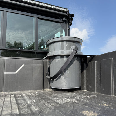 Installed PERFEX™ bucket holder holding a YETI 5-gallon bucket on UForce U10 XL PRO Highland – secure off-road utility setup (bucket not included)