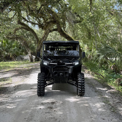 PERFEX 2.5-inch UTV lift kit in action on CFMoto UForce U10 XL PRO — equipped with 33” System3 XT400s and MSA 20” alloy wheels, front view captured on a sandy trail in Florida