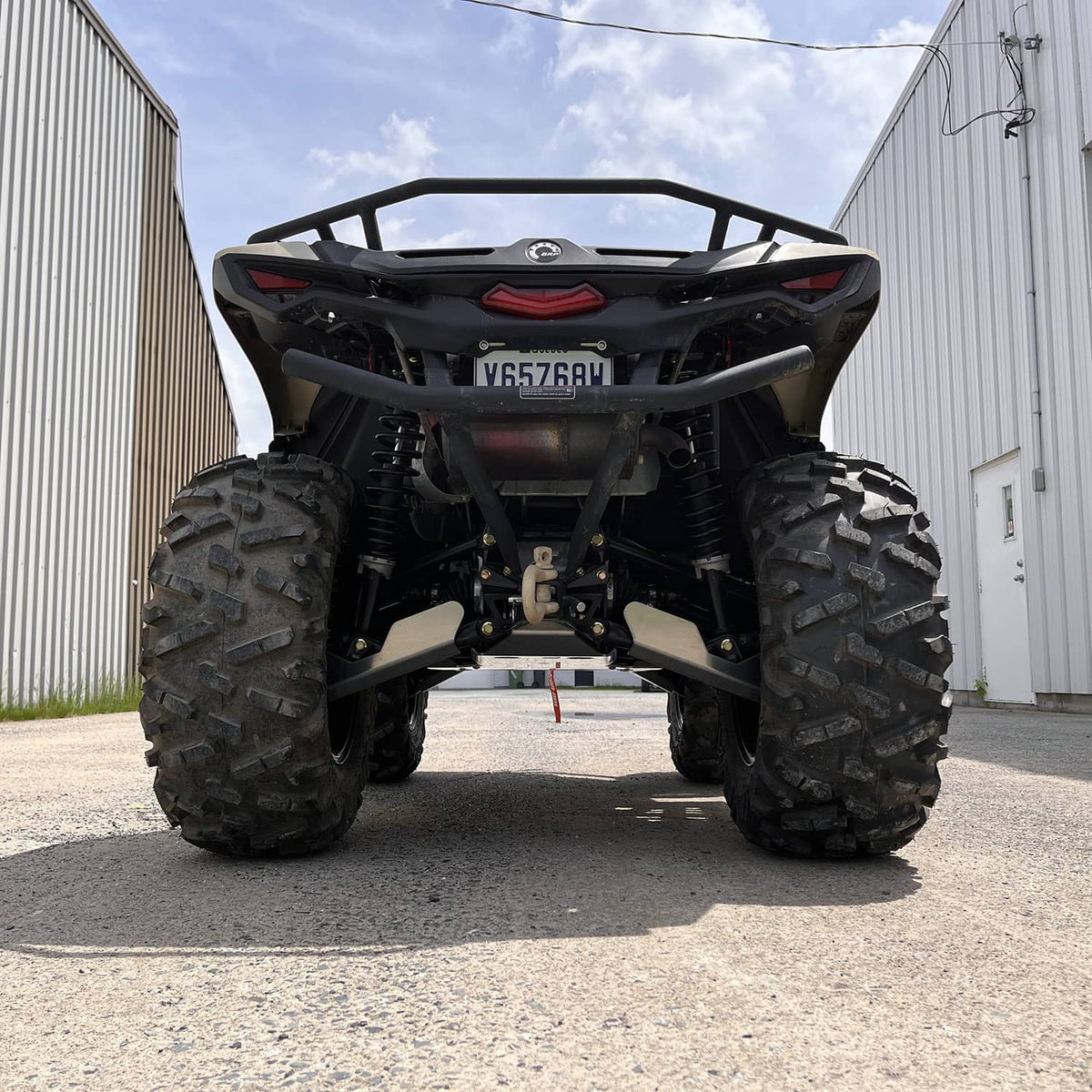 Rear view of a 2024 Can-Am Outlander 700 equipped with PERFEX Industries' aluminum complete protection kit. Perfect for off-road riders who need robust and enduring ATV protection.