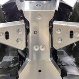 Close-up view of PERFEX Industries 3/16" heavy-duty aluminum 5052 central skid plate and front a-arm guards, providing robust protection for Kawasaki Brute Force ATVs during off-road adventures.