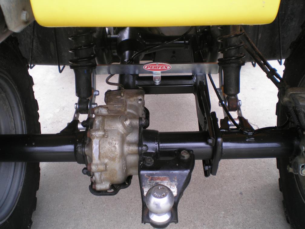 PERFEX long travel rear suspension kit for Honda Foreman 400/450/500 and Rubicon 500, showing the stainless steel components and hardware included in the package.