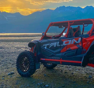 Featured on the 'Become Affiliate' page, the image displays a Honda Talon 1000 X-4 UTV with a Perfex-designed lift kit, set against a backdrop of sunset behind the mountains.