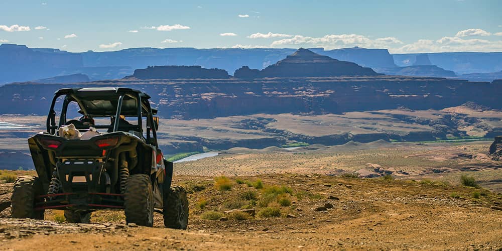 UTV from Perfex with a panoramic view of a distant mountain.