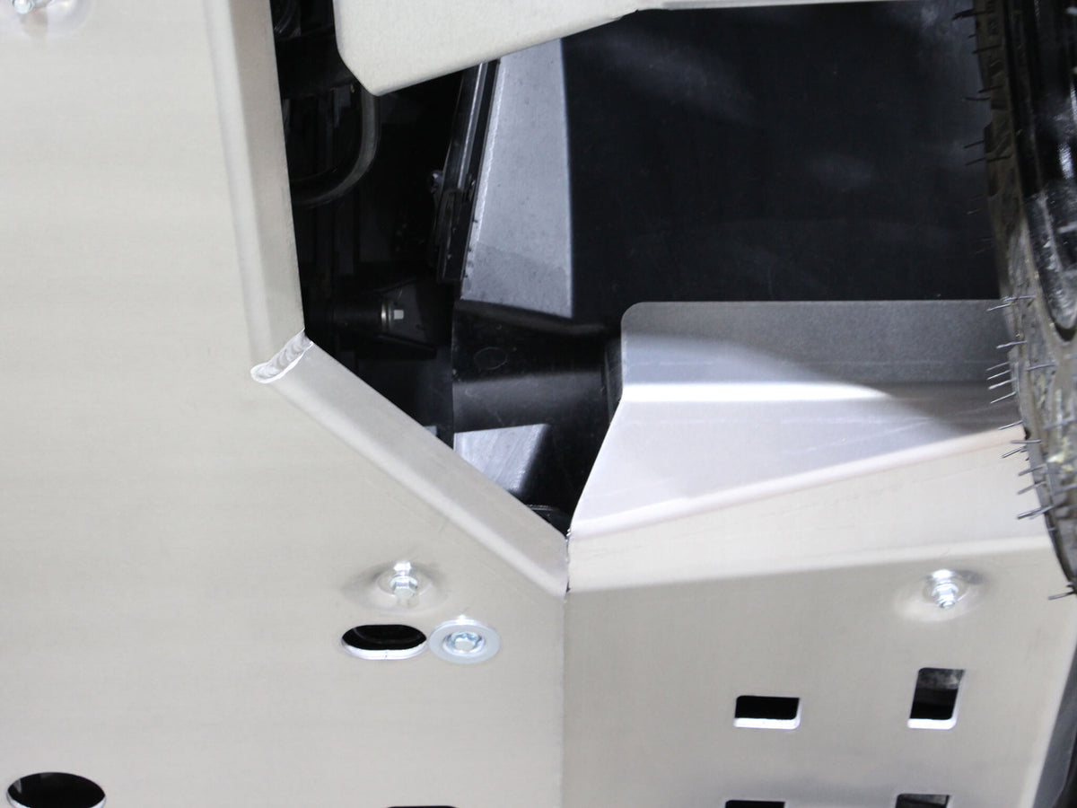 PERFEX aluminum footwell skid plate with raised front section protecting the rider from debris on a Can-Am Outlander MAX 6x6 450 G2L ATV