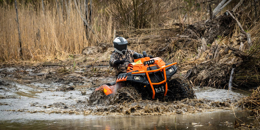ATV in mud, featured on the main page, showcasing the rugged capabilities of PERFEX parts.