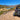 Lifted Polaris RZR Trail 900 rear view showing increased ground clearance on rocky trail.