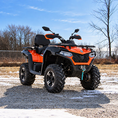 CFMOTO CForce 600 Touring with PERFEX suspension lift, shown from a front three-quarter angle.