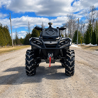 Front view of a Can-Am Outlander X MR 850 ATV with PERFEX 2-inch lift kit installed for increased ground clearance.