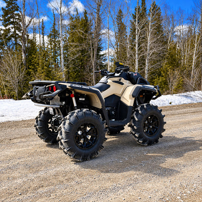 Rear three-quarter view of a lifted Can-Am Outlander X MR 850 with PERFEX 2-inch lift kit installed.