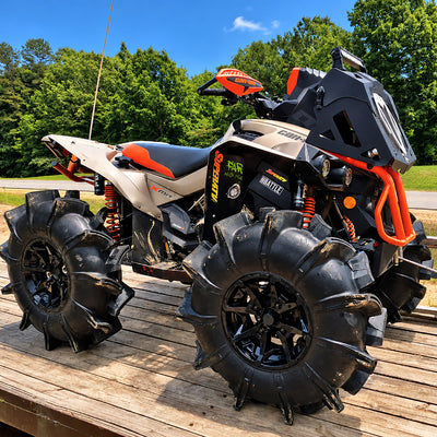 Front angle view of a Can-Am Renegade X MR ATV with PERFEX 2" lift kit, oversized mud tires and raised off-road stance.