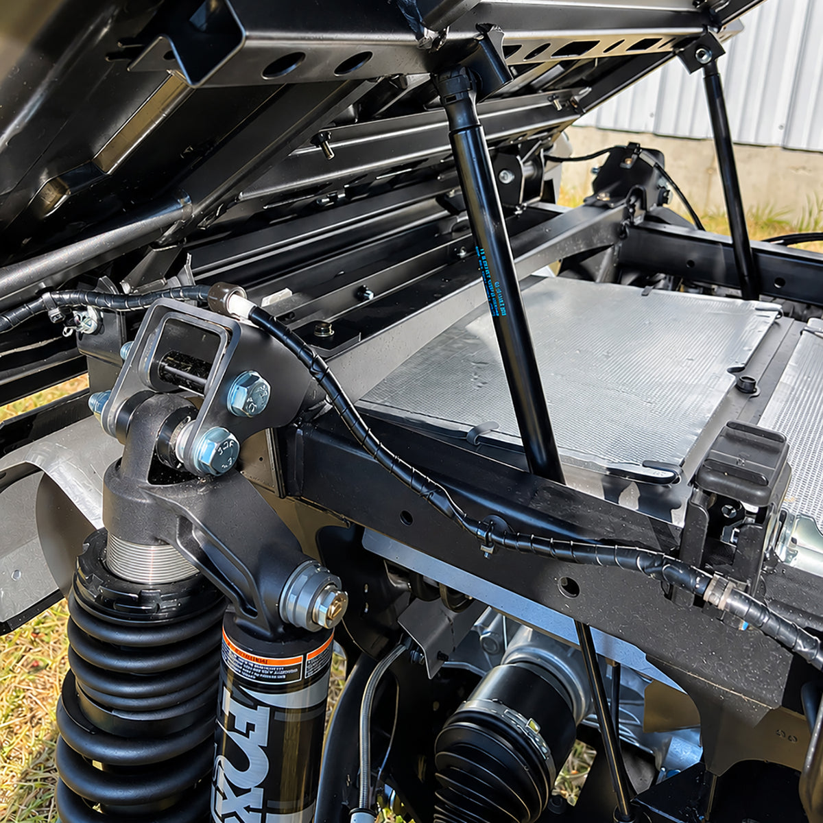 Rear suspension installation detail of the PERFEX 2-inch lift kit on Yamaha Wolverine RMAX2 1000.