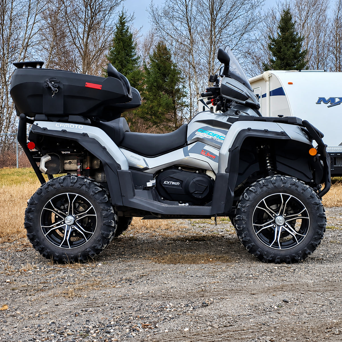 Side profile of a CFMOTO CForce 800XC with a PERFEX lift kit, highlighting its elevated ground clearance.