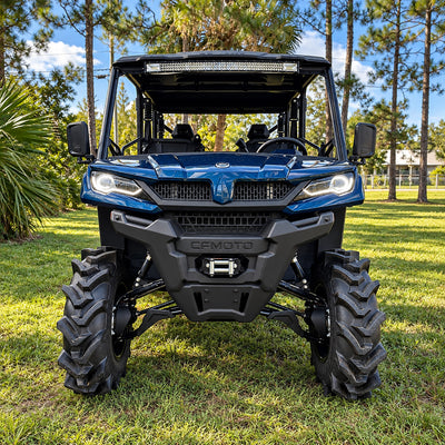 Front view of a blue CFMOTO UForce 1000 XL equipped with a PERFEX 2-inch suspension lift and aggressive 32" mud tires.