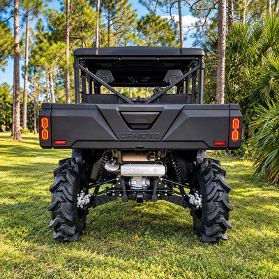 Rear view of a lifted CFMOTO UForce 1000 XL showing its suspension, drivetrain and ground clearance with a PERFEX 2-inch lift.